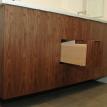 Custom built floating vanity made of matched grain Walnut